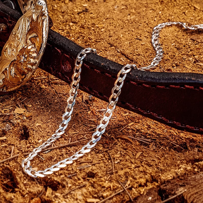 Silver Chain for Women on a log with a cuban link type